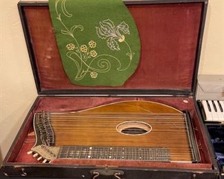 Antique Max Osterode Zither Stringed Instrument in case	3 x 26 x 15in	HxWxD
