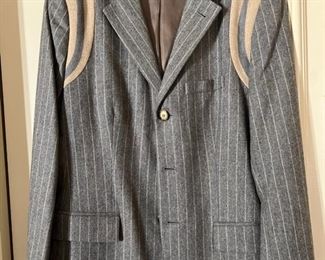 Sharp, funky, chic in a blazer. Heather grey, pin striped, blazer with letterman style shoulder details.  Instantly turns jeans and tee into an outfit!