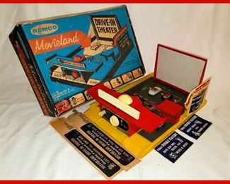Very Nice Remco Movieland Drive in Theater Toy with Signs, Cars and Film in Original Box; There are 3 Film Reels, not all showing. It appears to be complete in Original Box 