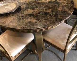 Marble 44" round top "Emperador"  brown on gold tone metal  curved legs, with 4 matching chairs.  The cream silk Like texture fabric has the original plastic cover, so the fabric is in original condition with no stains.  $375.00
