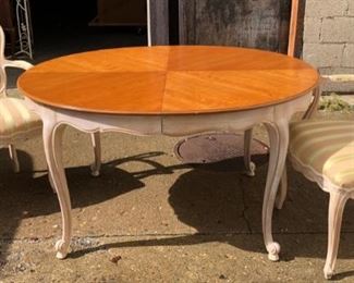 2 tone French oval table 44" X 54" with 3 custom made 16" leaves  (the apron on the leaves are straight and not curved like the table apron) Shown are the 2 arm chairs, there are 2 armless matching and the next photo shows 2 armless chairs with matching fabric