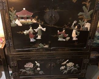 Asian  Coromandel Cabinet 38" X 22"d X 55" inch high, 3-piece includes the base plinth, chest and top door section that has a  removable back panel - not shown.  The Japanese women are done in carved stone and each side have carved stone floral accents with birds