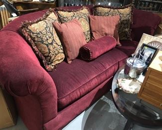 Two curved back rolled arm sofa 94" X 46" d X 34"  high with pillows shown.   The back has  tailored matching vertical pleats with inverted matching tapestry  fabric to the pillows shown.  Second sofa not shown can be sold separately 
