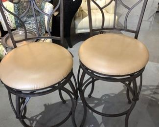 Pair of swivel metal bar stools 