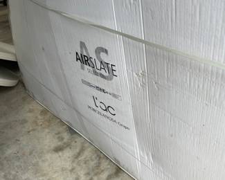 Porcelanosa Air Slate that looks like stone. Comes in 10ft sheets. 