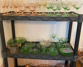 1st Shelf Filled with Pink. Green. Glass