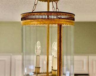 Vintage yellow chandelier. Measures 23" H x 12" D.