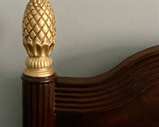 Councill Queen mahogany headboard with gilt pinecone finials. Measures 60” W x 46” H.