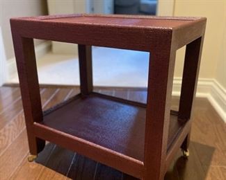 Oxblood colored sea grass side table on casters. Measures 24" W x 18" D. Photo 1 of 3.
