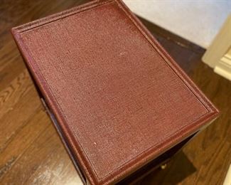 Oxblood colored sea grass side table on casters. Measures 24" W x 18" D. Photo 2 of 3.