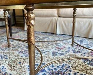 Brass and glass oval cocktail table. Measures 52" x 32" W x 19" H. Photo 3 of 3.