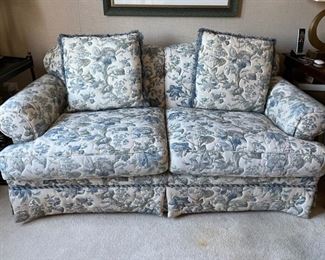 Love seat upholstered in quilted upholstered blue and white fabric. Measures 72" W x 39" D.
