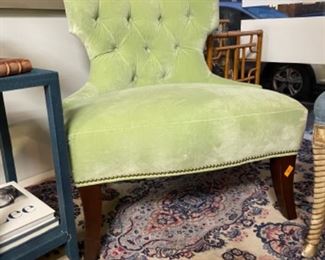 Slipper chair upholstered in green velvet upholstery with nailhead trim. Measures 30" W x 28" D. Photo 1 of 2.