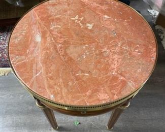 Vintage side table with marble top and brass gallery. Has two drawers and two hidden pull out drink trays. Measures 24” D x 27” H. Photo 2 of 4.