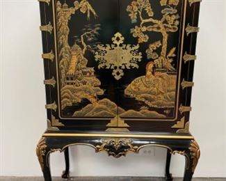 1 piece black lacquer chinoiserie cabinet with brass hardware and ball and claw feet. Measures 68" W x 40" W x 25" D. Photo 1 of 3.