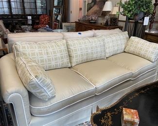 Sherrill curved-back, three-seat silk blend upholstered sofa with down-filled pillow and white piping trim. Measures 88" W x 33" D. Photo 1 of 2.