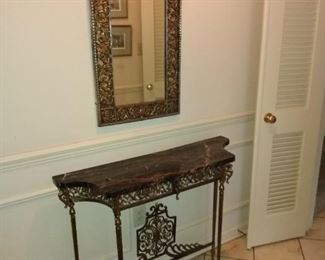 Brass and marble entry table with mirror. Sturdy, elegant and shallow to accommodate most entryways 