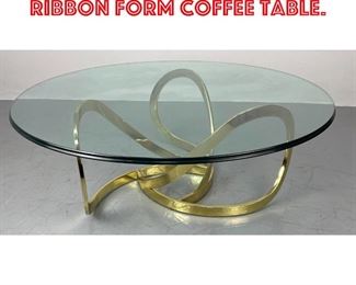 Lot 121 Brass Tone and Glass Ribbon Form Coffee Table. 