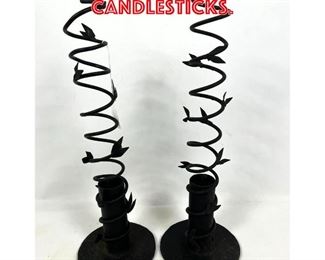 Lot 209 Pair Twisted Iron Candlesticks.