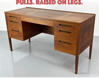 Lot 214 Modernist Desk. Inset pulls. Raised on legs. 