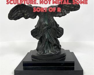 Lot 226 Dali Double Winged Sculpture. Not metal. Some sort of r