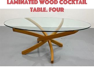 Lot 406 Modernist Glass Top Laminated Wood Cocktail Table. Four