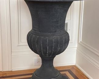 Black metal urn with faux boxwood topiary - 2 available. Urn measures 30”H with a 10” x 10” base. Topiary measures 4’ H. Photo 2 of 2.