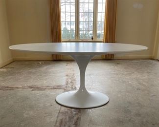 Saarinen-Style Oval White Lacquer Tulip Table. Measures 67" W x 43" D x 30" H with 29" clearance. Photo 1 of 3.