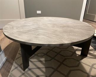 Four Hands Weathered Wood Cocktail Table with Black Metal Base. Measures 48"D x 15" H. Photo 1 of 3.