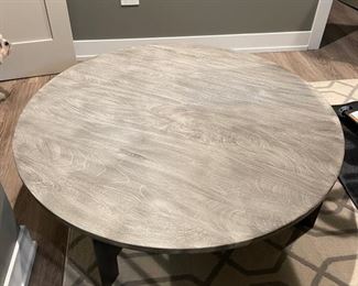 Four Hands Weathered Wood Cocktail Table with Black Metal Base. Measures 48"D x 15" H. Photo 2 of 3.