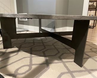 Weathered Wood Cocktail Table with Black Metal Base. Measures 48"D x 15" H. Photo 3 of 3.