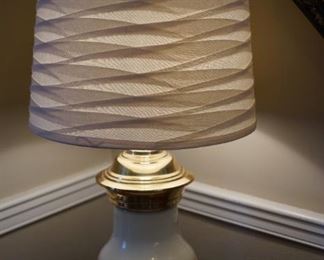 Quality lamp with fabric woven shade. Solid brass and enamel center of ivory tone