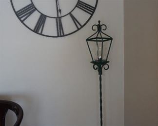 Metal Art wall clock and candle lantern on stand