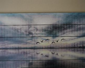 Painting on board of birds over lake