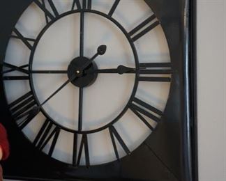 Selection of wall clocks in black metal designer Pottery Barn and Wayfair.