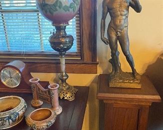 Male Statute on one of the many walnut stands in the sale!
