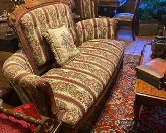 Outstanding settee....upholstery matches the upholstery on the 4 chairs in the background!