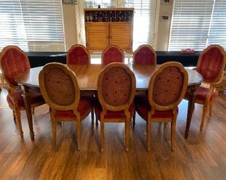 dining table and cane back chairs, fabric backs can be removed and seats can be recovered - there is a matching buffet