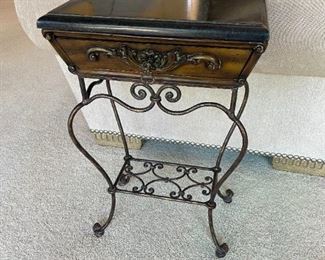 wood table has a single drawer that pulls out.