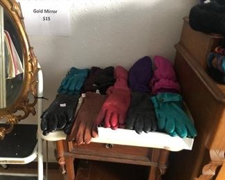 Lots of leather gloves, mittens, hats and scarves