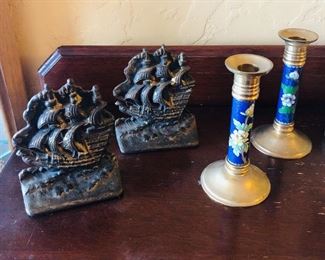 Pair of vintage cast iron ship bookends, brass cloisonné candlesticks