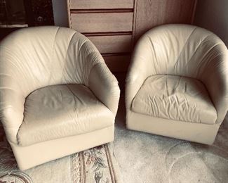 Pair light tan leather swivel chairs
