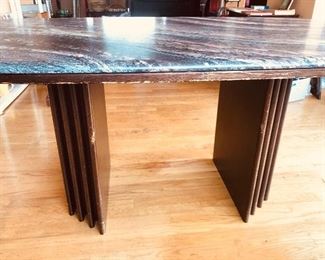 Side view of table - top lifts off of 2 base pieces.