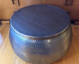Round silver color hammered metal coffee table with storage inside - top lifts off (29" diameter, 16" high)