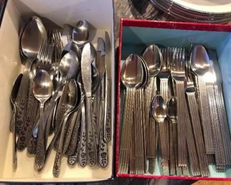 Two of several sets of stainless flatware (left is rose pattern by Barclay Geneva, right is by IKEA)