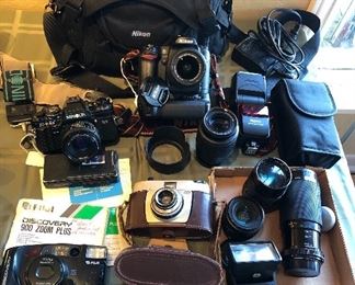 1983 Minolta X-700 camera, Nikon D-80 camera with 18-55mm lens & battery pack, Nikon Speedlight SB-600 flash, Nikon ED 55-200mm lens, Kiron 80-200 mm lens, Minolta 50mm 1:1.7 lens, Spectrum 350 MD flash, Wards camera (Germany), Fuji Discovery 900 Zoom Plus camera