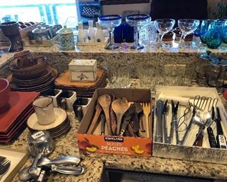 Utensils, assorted dishes, colored glasses