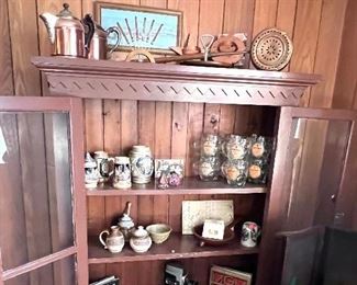 Vtg. Glass door cabinet - this picture makes it look like the cabinet doesn't have a back but it does, it's a skinner planel back