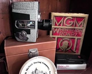 MGM When the Lion Roars book, Troch McNeil Paving Company ashtray and Wollensak camera