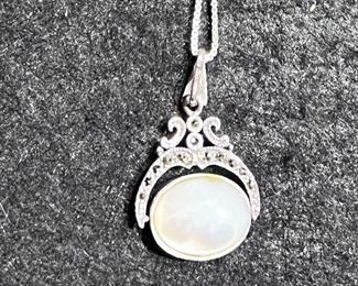 Sterling Silver - this necklace flips from a white stone to a black stone - SOME OF THE JEWELRY MAY BE SOLD